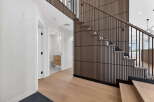 Step into modern elegance with this stunning property featuring a beautifully designed staircase.
