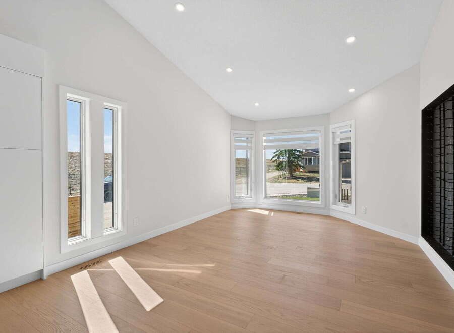 Step into this bright and airy living space, featuring stunning hardwood floors and an abundance of natural light.