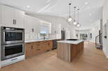 This stunning kitchen boasts modern design with sleek cabinetry and a spacious island.