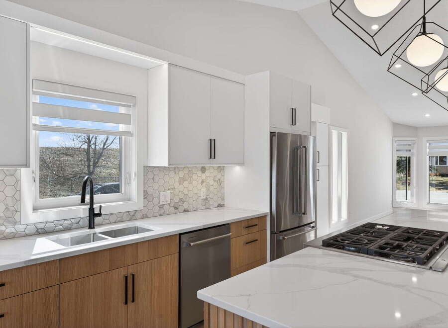 This stunning kitchen boasts modern design elements and high-end finishes.