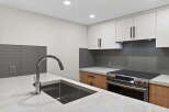 This modern kitchen boasts sleek design elements and high-end appliances.
