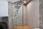 Step into luxury with this stunning bathroom featuring a modern glass shower enclosure.