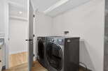 This modern laundry room features a sleek washer and dryer set, perfect for efficient home management.
