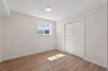 Discover the charm of this inviting bedroom, featuring a bright and airy atmosphere.