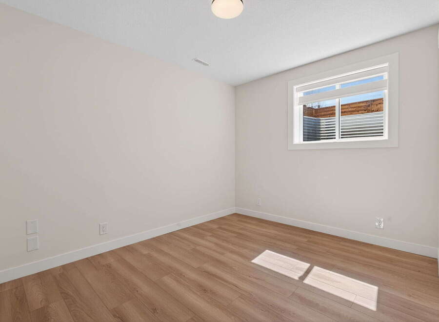 This inviting room features a neutral color palette, creating a versatile space ready for your personal touch.
