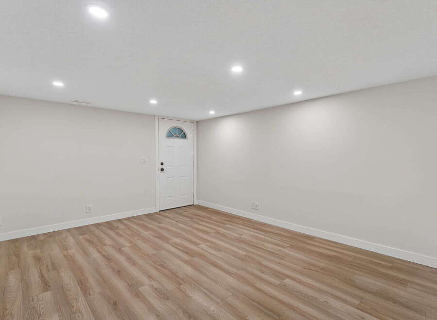 Step into this inviting space, featuring a bright and airy interior with neutral walls and modern recessed lighting.