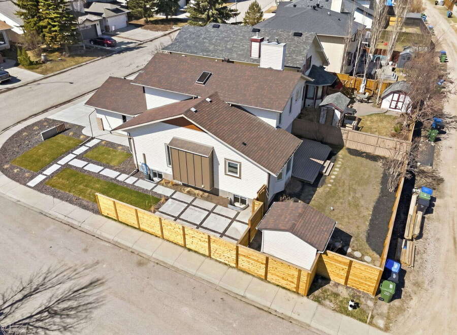 This stunning property boasts a modern design with a beautifully landscaped front yard and a private backyard oasis.