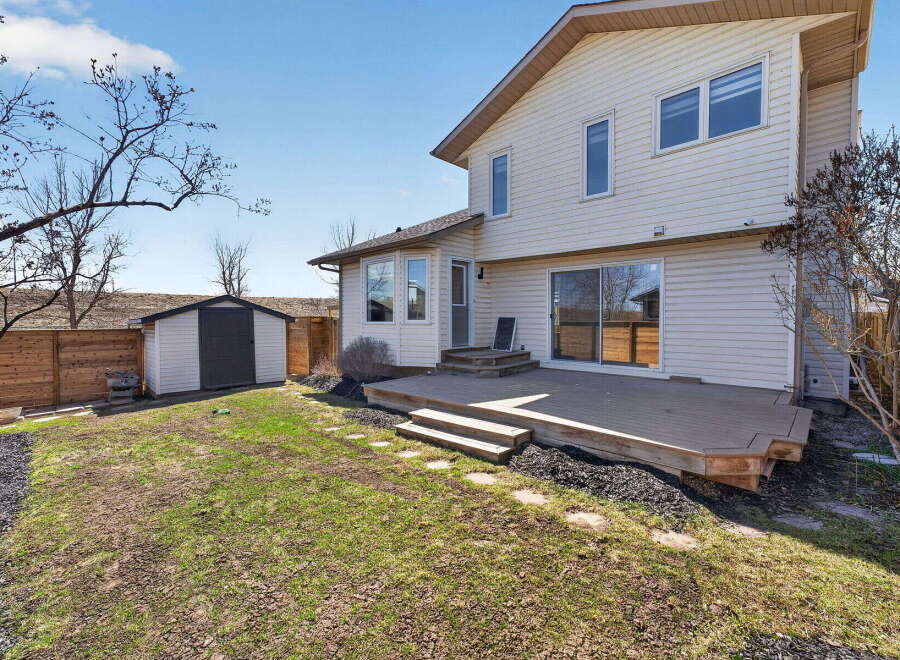 Enjoy outdoor living on this beautiful property! This home features a spacious deck, perfect for entertaining or relaxing.