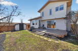 Enjoy outdoor living on this beautiful property! This home features a spacious deck, perfect for entertaining or relaxing.