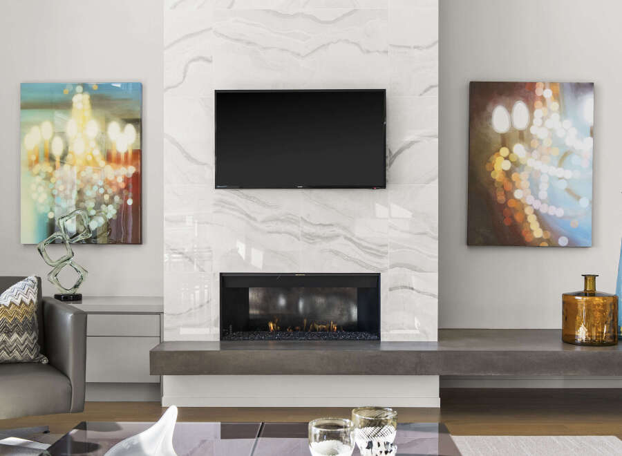 This stunning living space features a modern fireplace with a sleek, built-in design, perfect for cozy evenings.