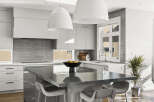 This modern kitchen boasts a sleek design with a large island, perfect for meal prep and entertaining.