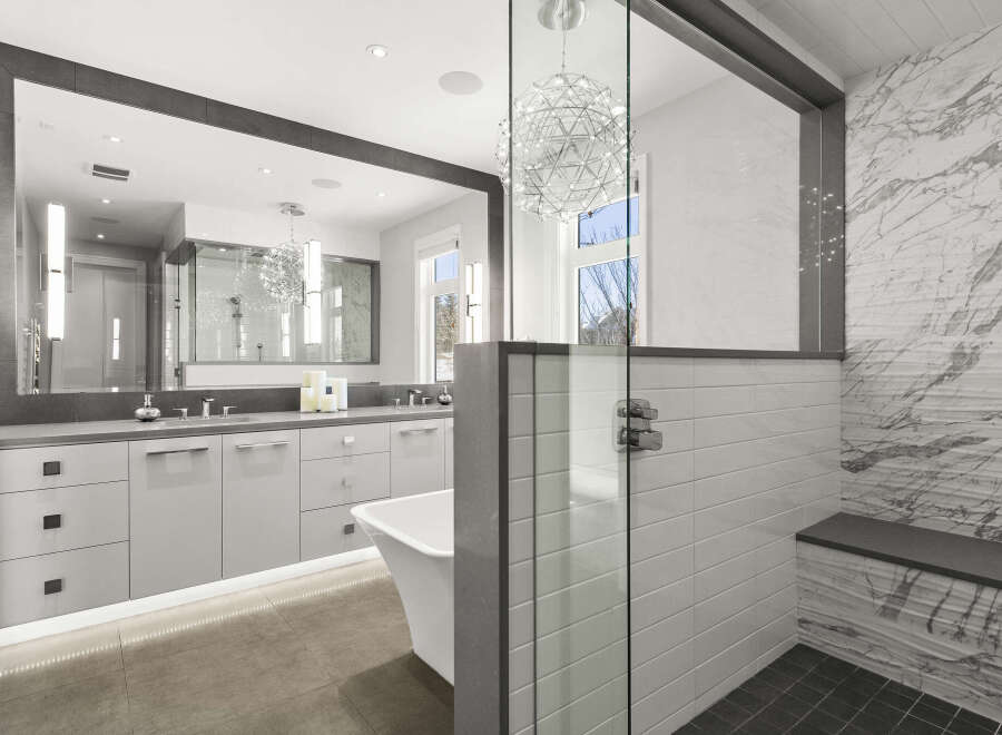 Step into luxury with this stunning bathroom featuring a sleek, modern design.