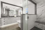 Step into luxury with this stunning bathroom featuring a sleek, modern design.