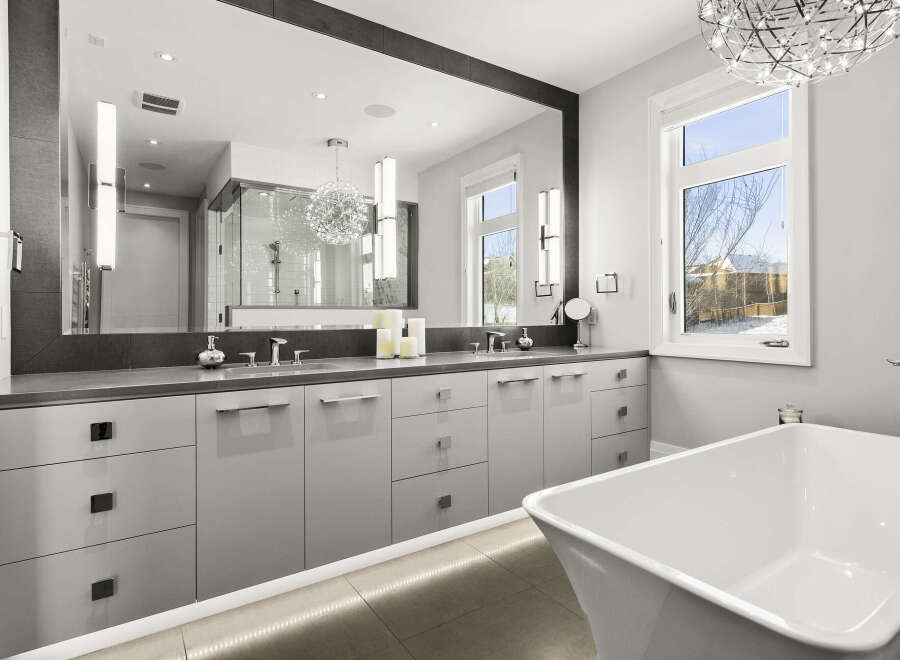 Step into luxury with this stunning bathroom, featuring a sleek, modern design.