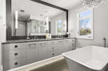 Step into luxury with this stunning bathroom, featuring a sleek, modern design.