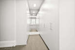 Step into modern elegance with this stunning hallway.