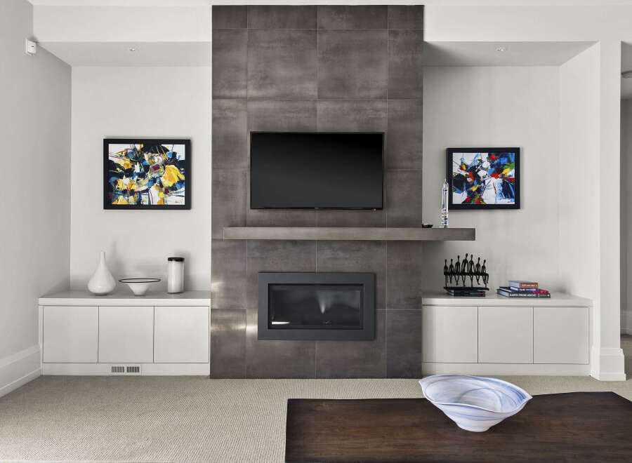 This stunning living room showcases a modern fireplace with a built-in TV, creating a focal point for relaxation and entertainment.