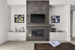 This stunning living room showcases a modern fireplace with a built-in TV, creating a focal point for relaxation and entertainment.