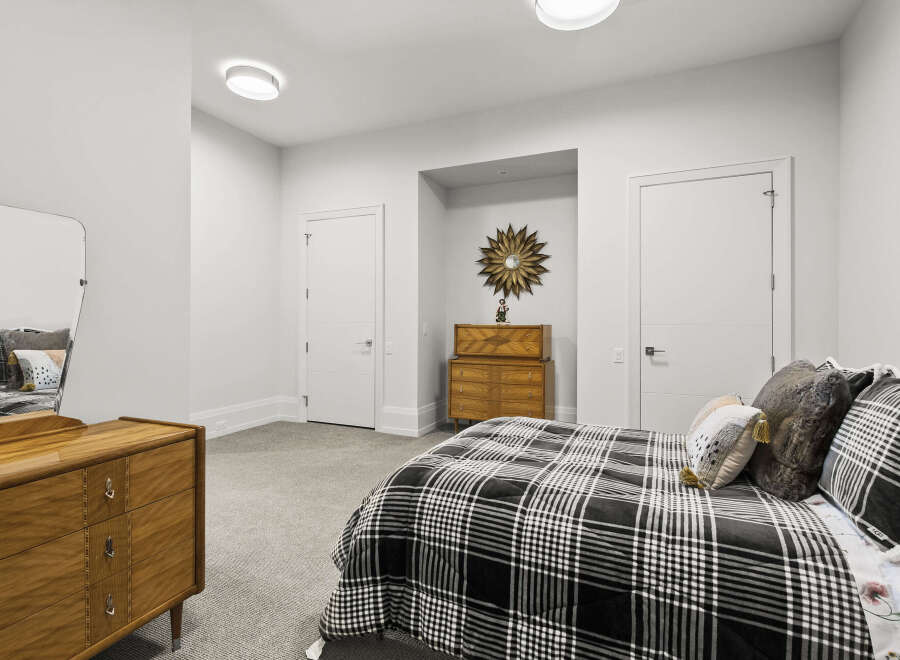 Step into this elegant bedroom, where modern design meets comfort.