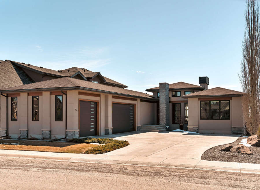 This stunning modern home boasts a sleek design with a neutral color palette and clean lines.