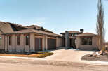 This stunning modern home boasts a sleek design with a neutral color palette and clean lines.