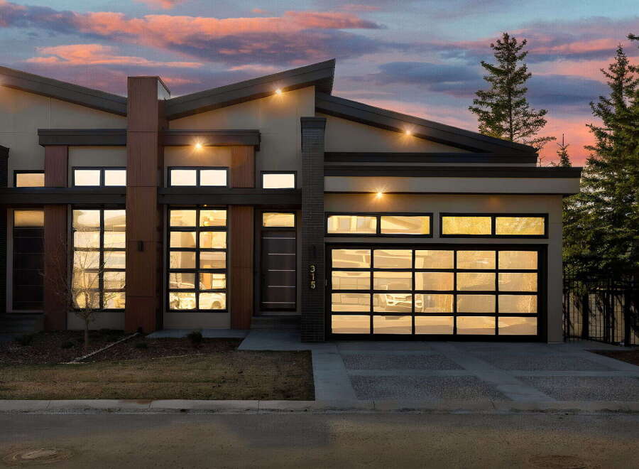 This stunning modern home boasts a sleek design with a contemporary facade.