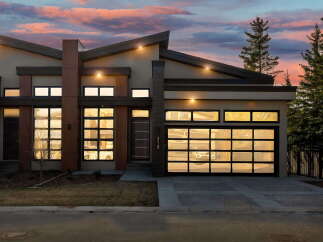 This stunning modern home boasts a sleek design with a contemporary facade.