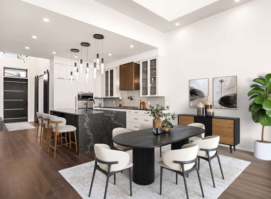 Step into luxury with this stunning modern kitchen and dining area.