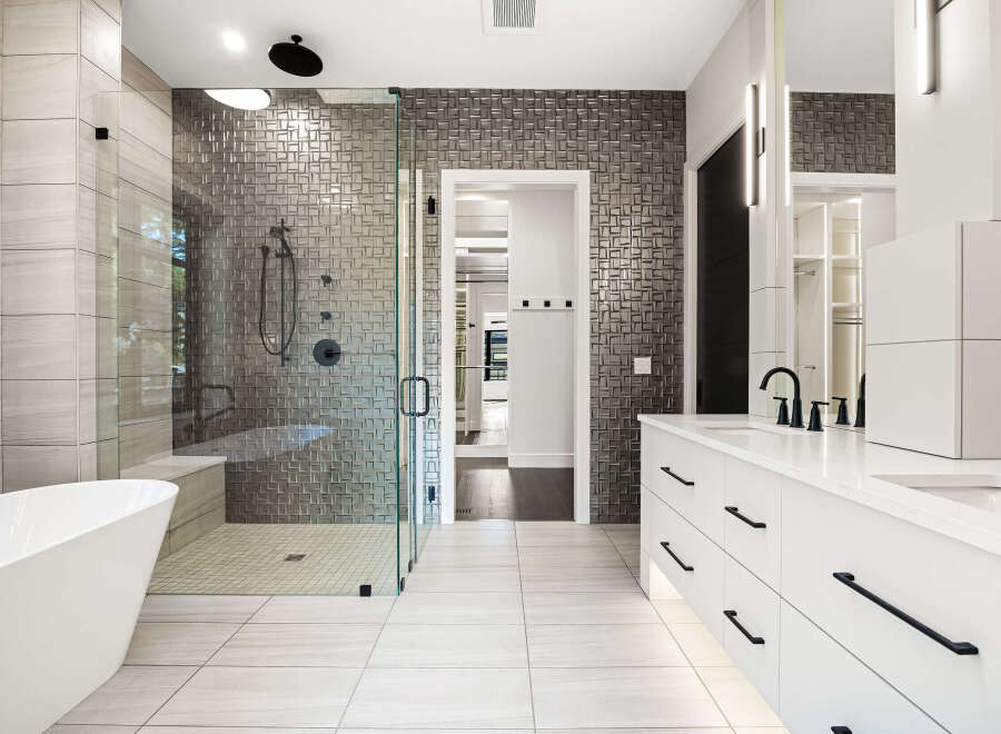 Step into luxury with this stunning bathroom, featuring a modern design and high-end finishes.