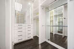 Step into luxury with this stunning walk-in closet, designed for both style and functionality.
