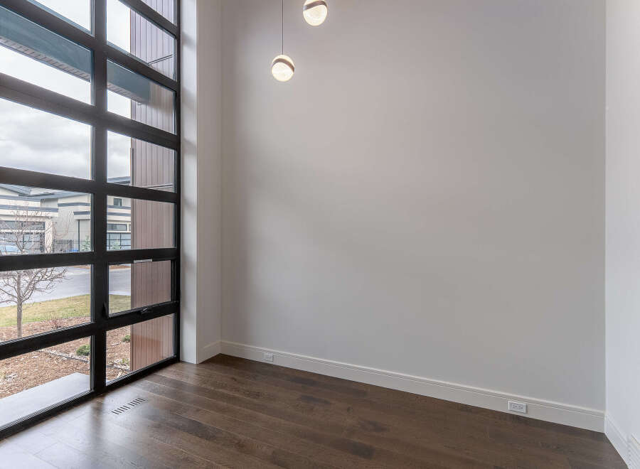 Step into modern elegance with this stunning property, featuring expansive windows that flood the space with natural light.