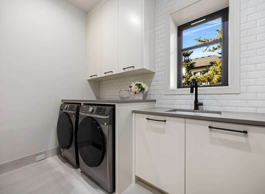 This modern laundry room boasts sleek design and functionality.