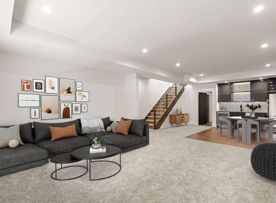Discover modern living in this stunning property! Featuring a spacious open floor plan, the home boasts a stylish living area with a comfortable sectional sofa and a collection of art.