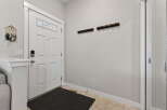 Step into this inviting entryway, showcasing a modern design with a touch of warmth.