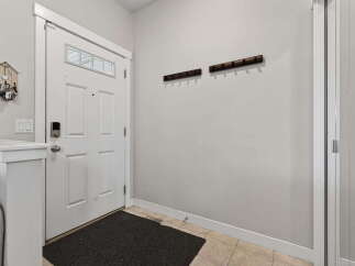 Step into this inviting entryway, showcasing a modern design with a touch of warmth.