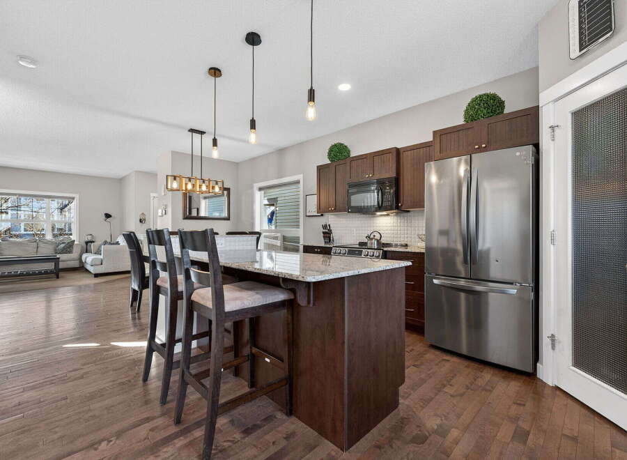 This stunning kitchen boasts a modern design with a spacious island, perfect for entertaining.
