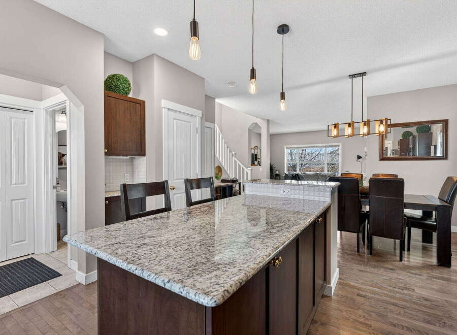 This stunning kitchen boasts a spacious island with granite countertops, perfect for meal prep and entertaining.