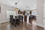 Step into this stunning home featuring a modern kitchen and dining area.