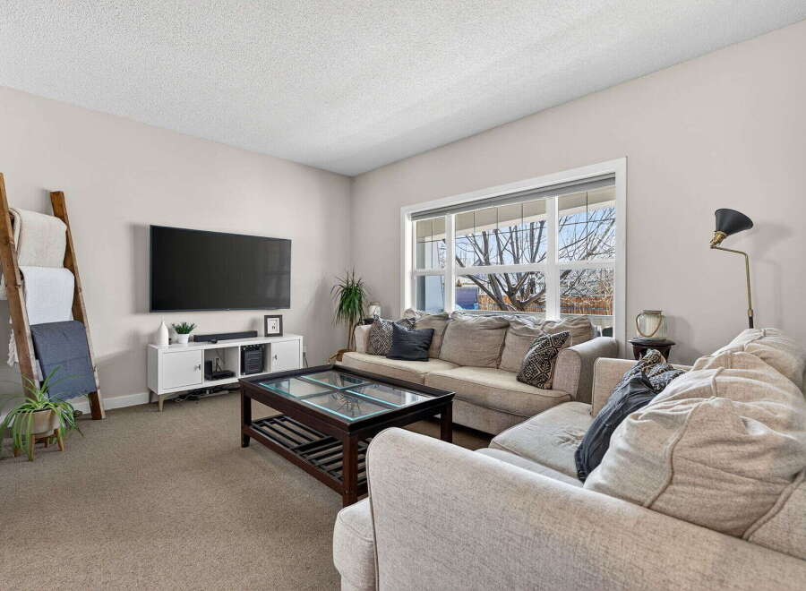 This stunning living room offers a comfortable and inviting space for relaxation and entertainment.