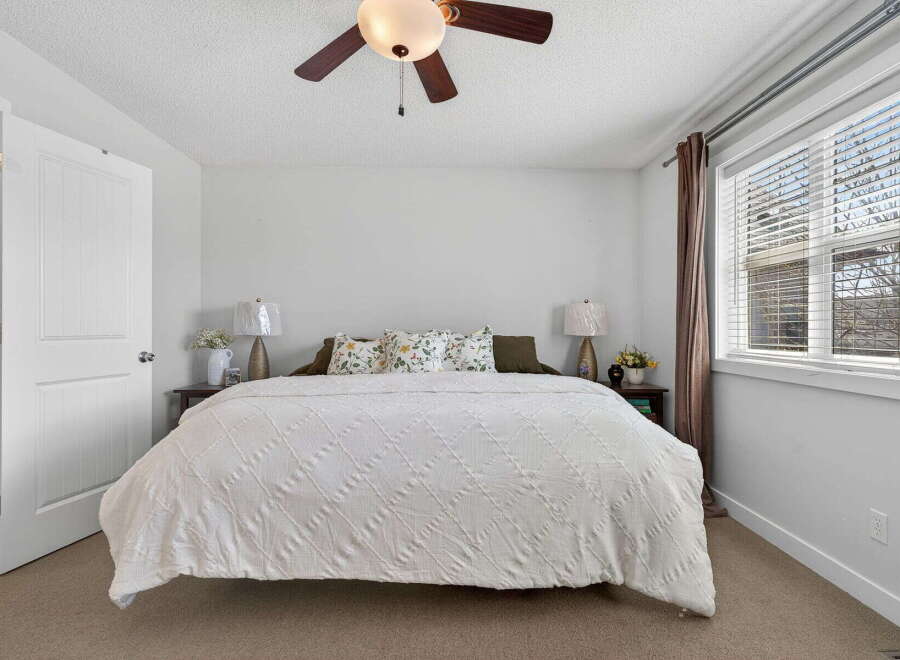 This inviting bedroom showcases a cozy and comfortable atmosphere, perfect for relaxation.