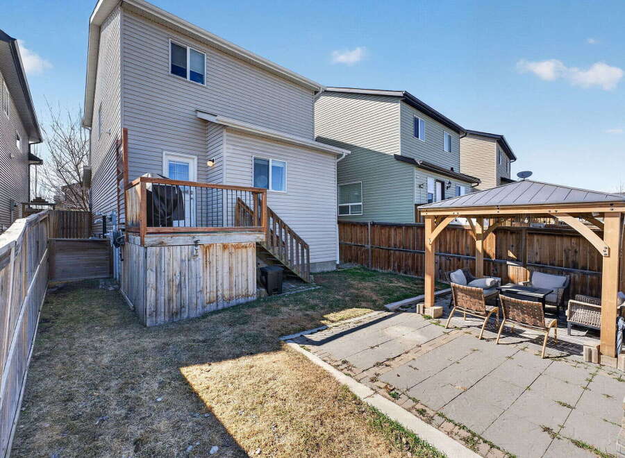 Enjoy outdoor living in this beautiful backyard! This property features a spacious deck, perfect for entertaining, and a charming gazebo, ideal for relaxing.