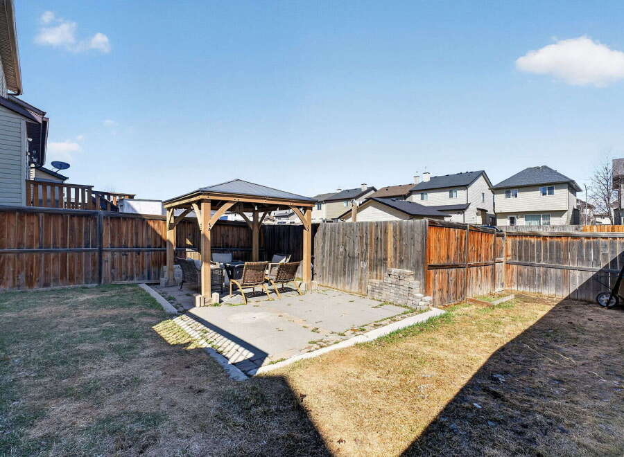Enjoy outdoor living in this beautiful backyard oasis! This property features a charming gazebo, perfect for entertaining or relaxing.