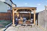 Enjoy outdoor living in this stunning backyard oasis! This property features a beautiful gazebo, perfect for entertaining or relaxing.