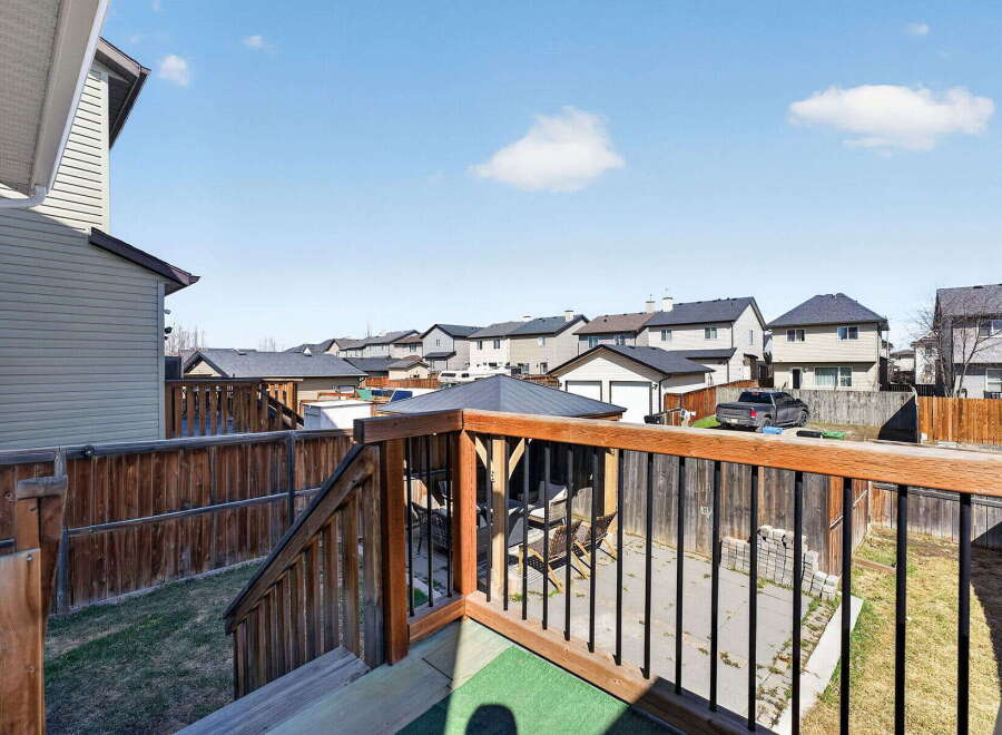 Enjoy the tranquility of this beautiful backyard oasis! This property features a spacious deck with a charming gazebo, perfect for outdoor entertaining.