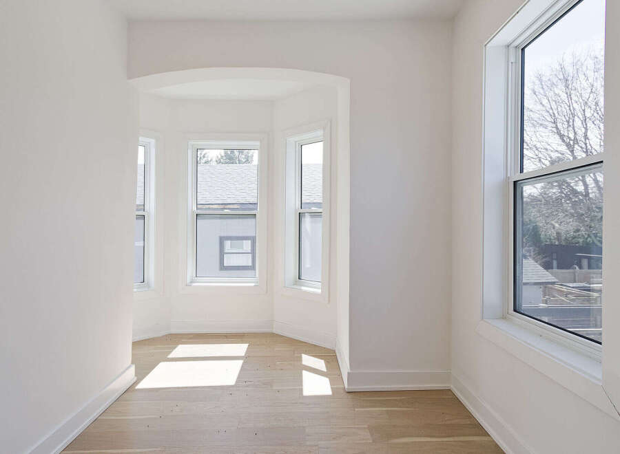 Step into this bright and airy space, featuring a unique bay window design that floods the room with natural light.