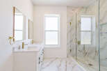 Step into luxury with this stunning bathroom featuring a sleek, modern design.