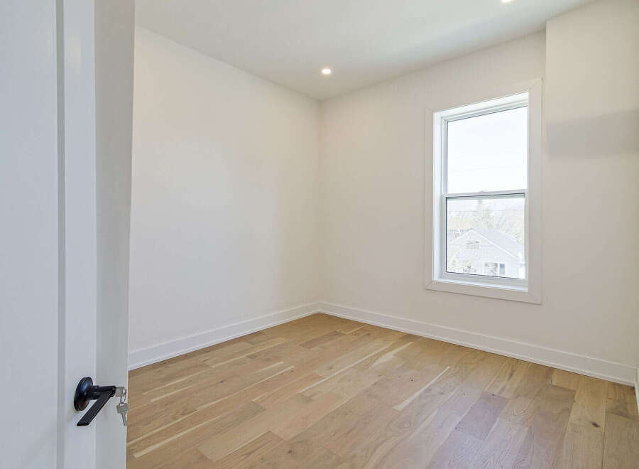 Discover the charm of this inviting room, featuring beautiful hardwood floors that add warmth and character.