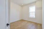 Discover the charm of this inviting room, featuring beautiful hardwood floors that add warmth and character.