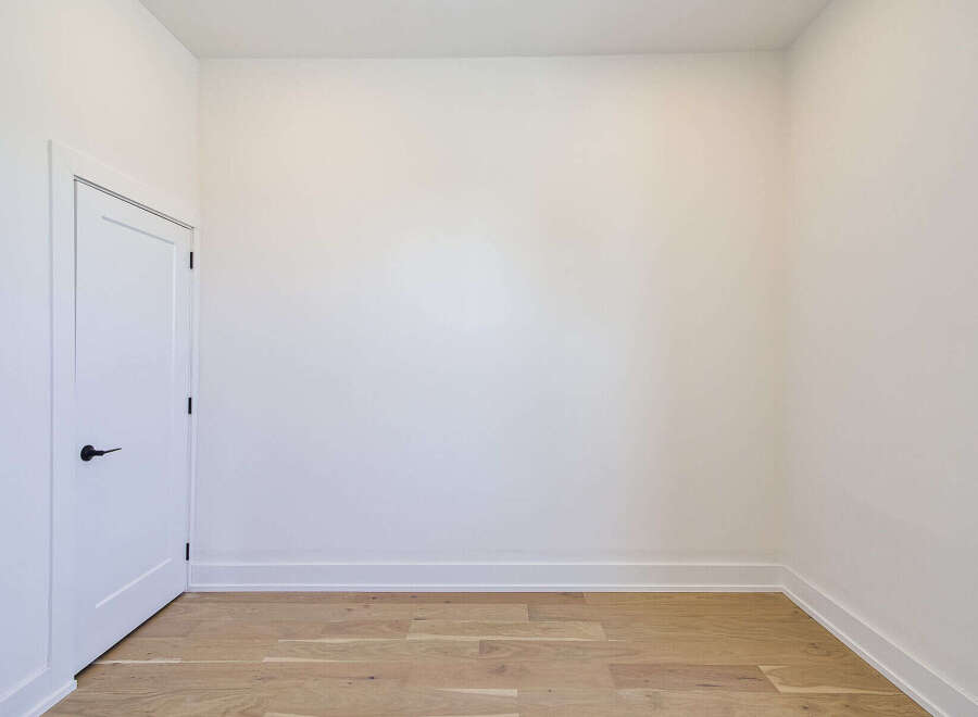 Step into this bright and airy space, perfect for a home office or a cozy reading nook.