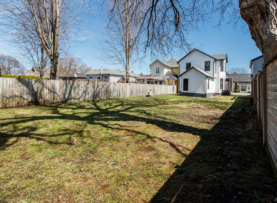 Discover the potential of this spacious backyard, perfect for creating your dream outdoor oasis.